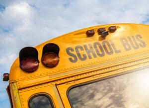 The back of a yellow school bus.